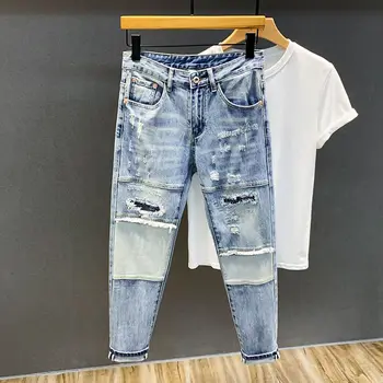 A primavera e o Outono estilo de high street patch ripped jeans masculina na moda mendigo de ajuste fino do pé pequeno calças compridas versão coreana
